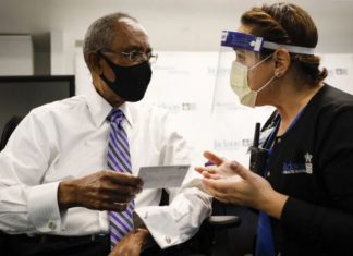 Keep Your COVID-19 Vaccine Card Safe But Don’t Laminate It. Here’s Why